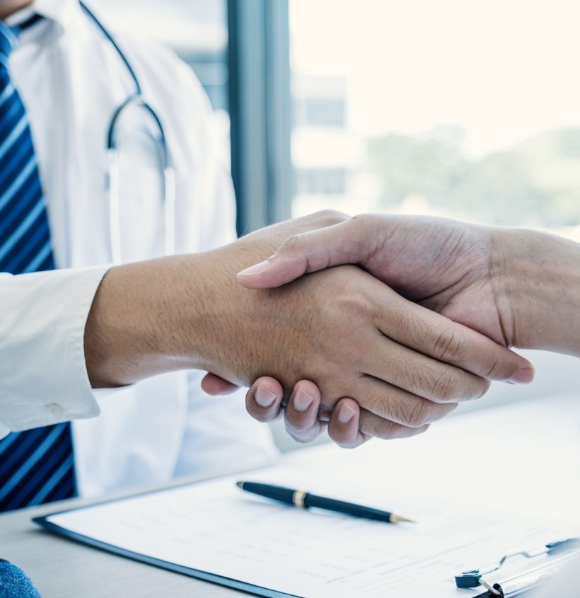 Handshake after doctor explained the health examination results to the patient, medical checkup