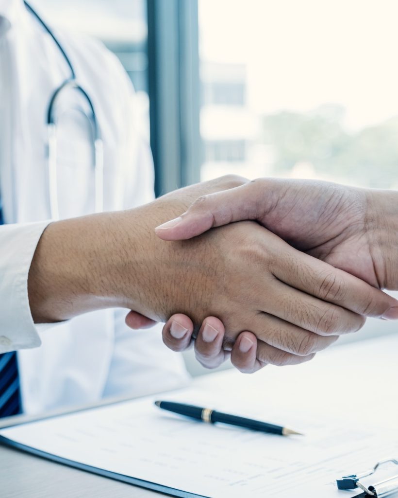 Handshake after doctor explained the health examination results to the patient, medical checkup